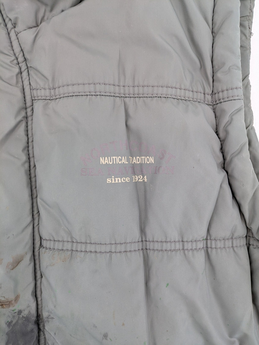 Camargue grey quilted jacket with fleece collar and buttoned pockets.