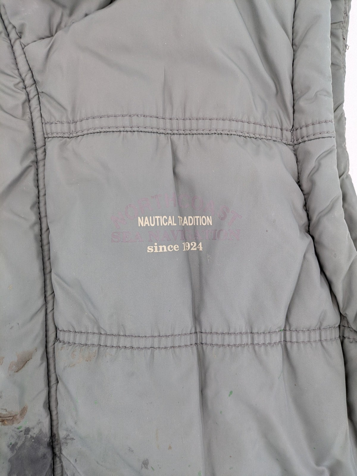 Camargue grey quilted jacket with fleece collar and buttoned pockets.