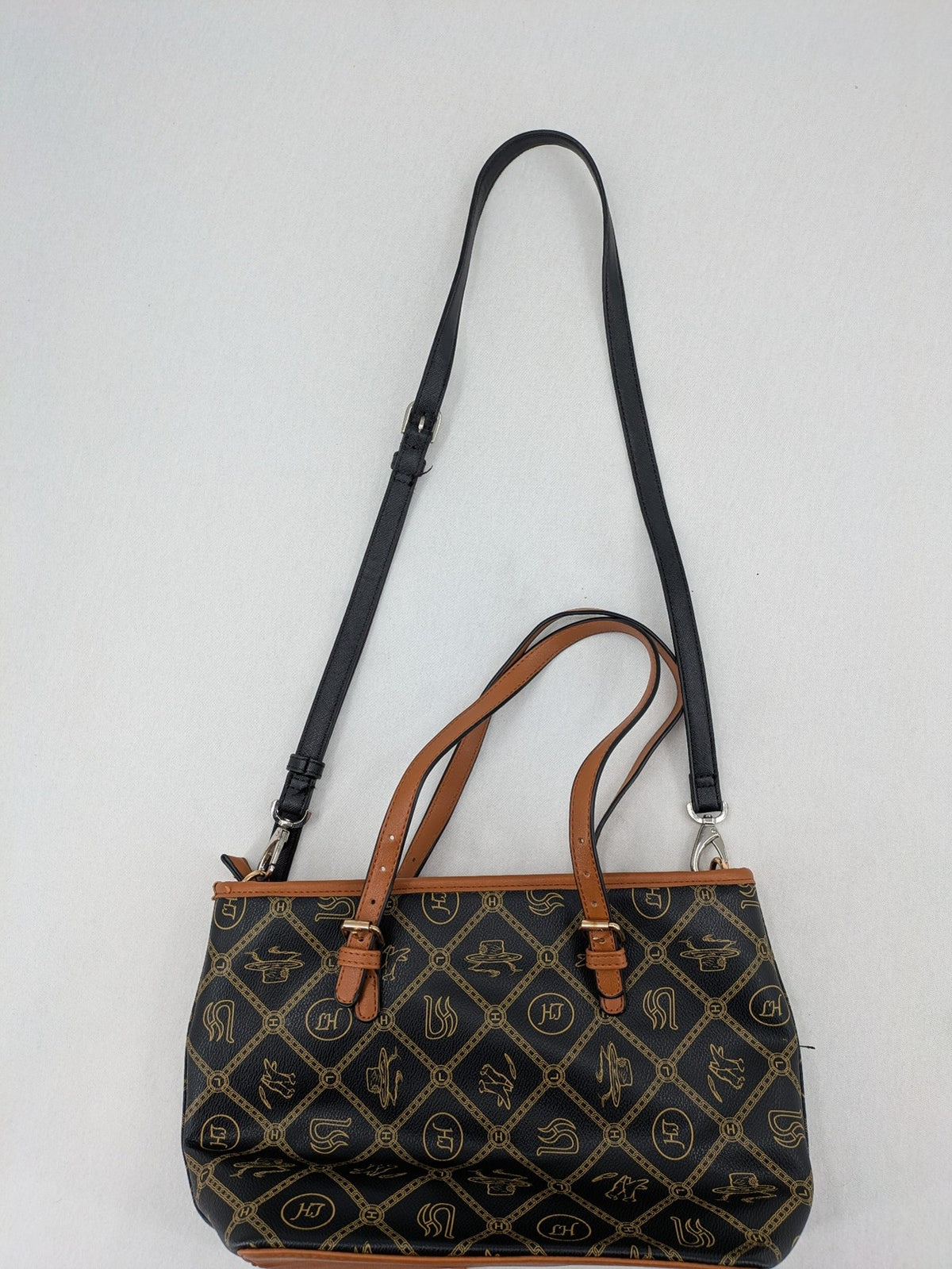 L&H brown and black handbag with monogram pattern and gold accents, versatile shoulder strap.