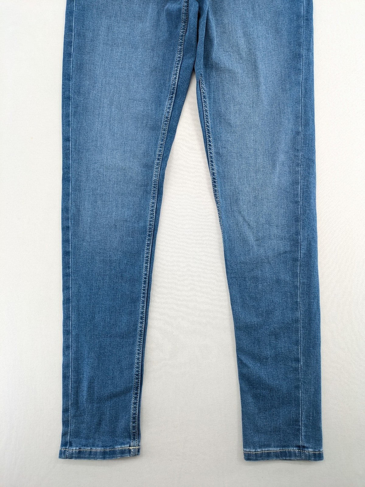 ESMARA blue super skinny jeans with medium waist and stretchy cotton blend material.