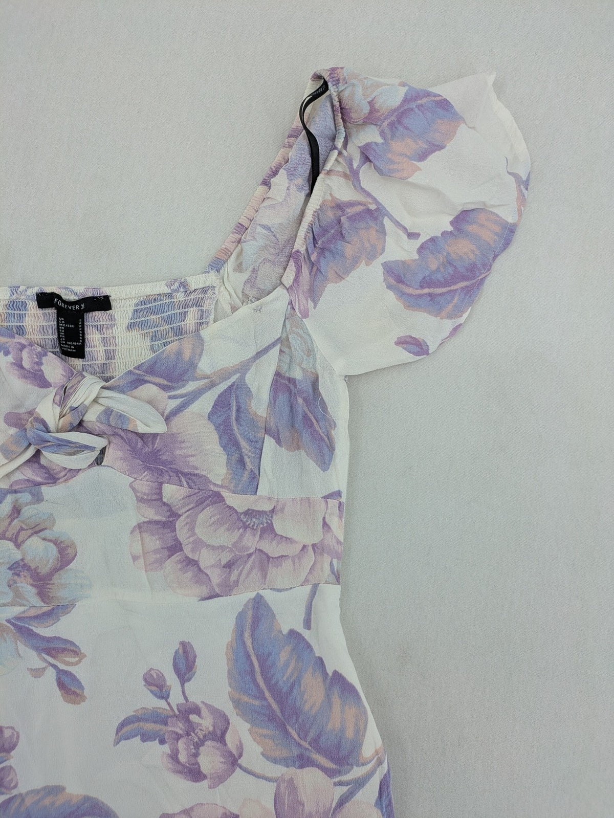 Forever 21 women's midi dress white with blue and purple floral pattern, smocked bodice, puff sleeves.