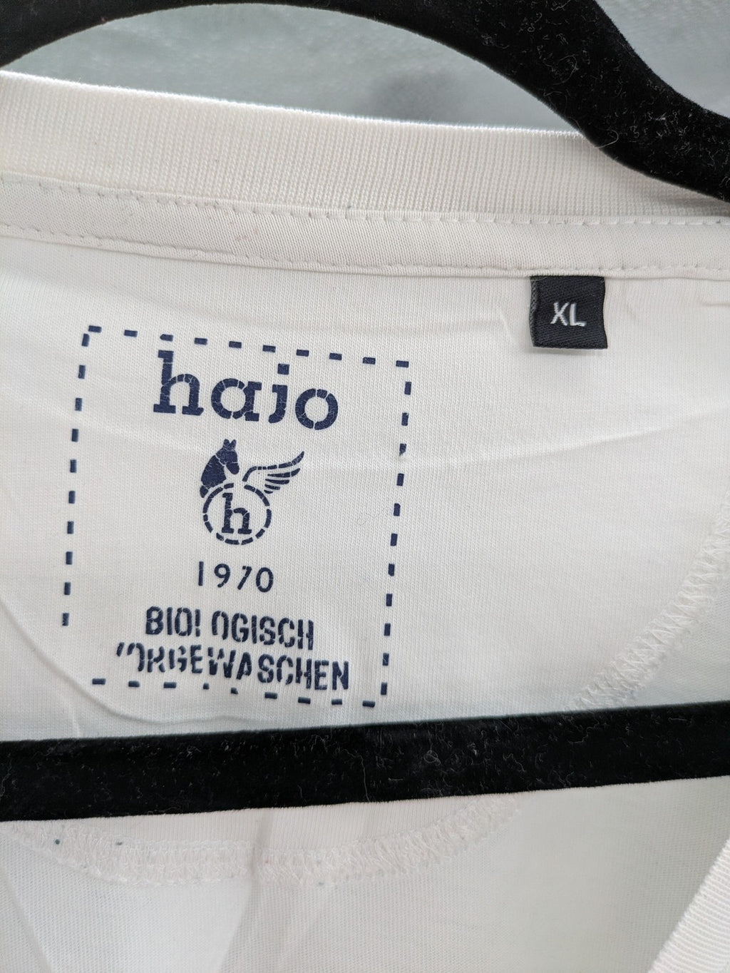 Hajo white short-sleeve t-shirt with subtle logo embroidery and side slits.