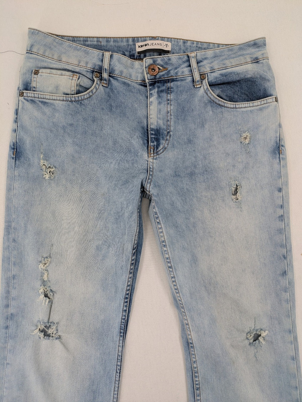 Koton Jeans blue straight jeans with distressed details and classic 5-pocket style.