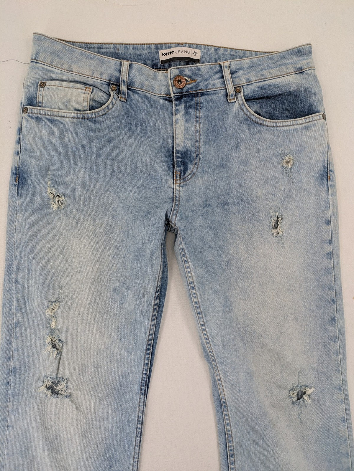 Koton Jeans blue straight jeans with distressed details and classic 5-pocket style.