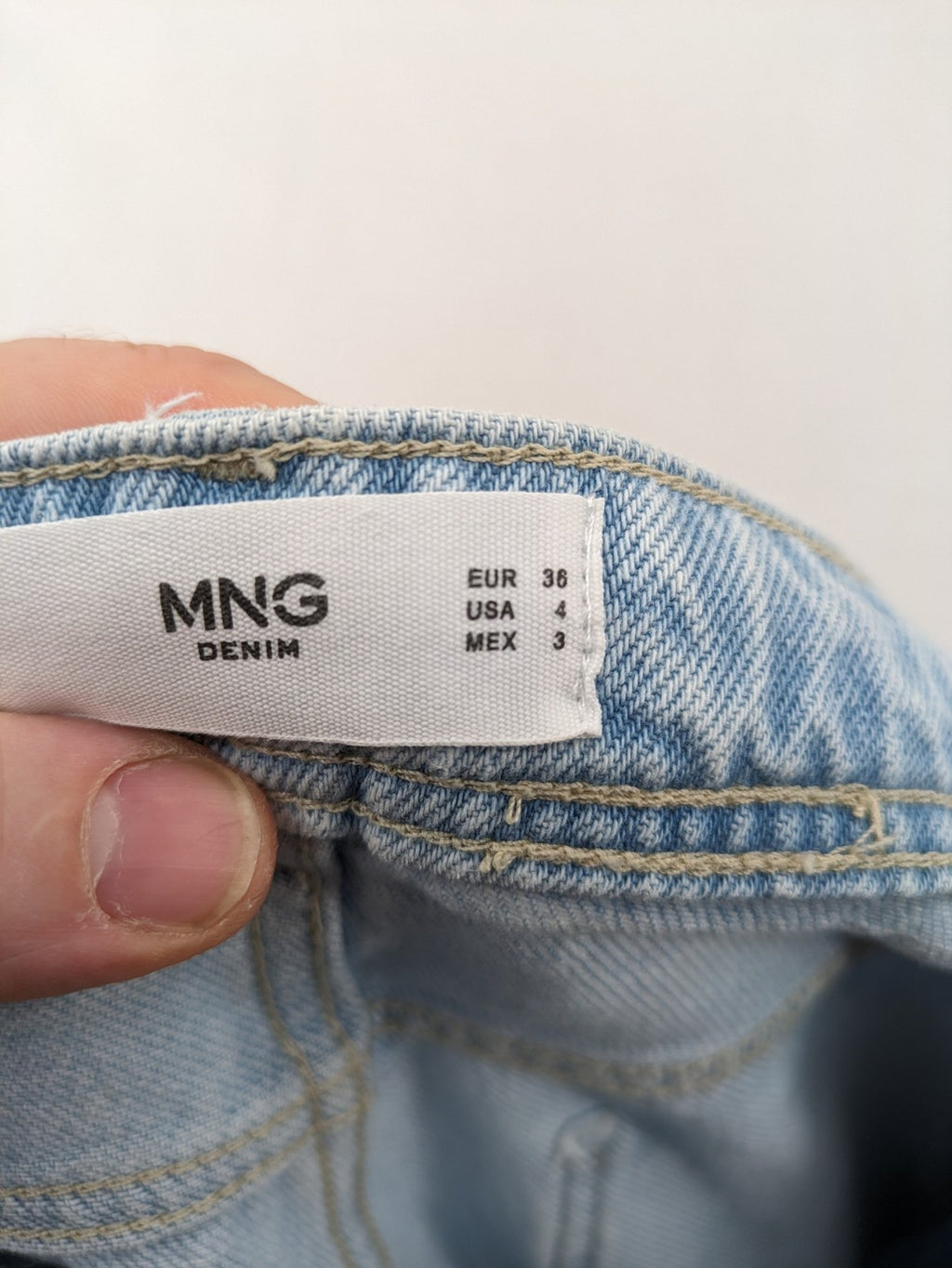 MNG blue straight jeans with cargo pockets and raw hem, high waist denim.