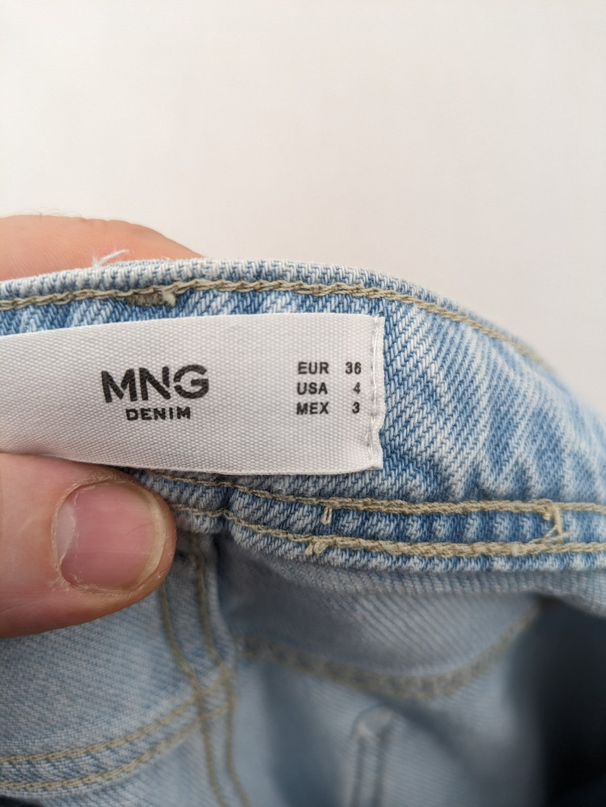 MNG blue straight jeans with cargo pockets and raw hem, high waist denim.