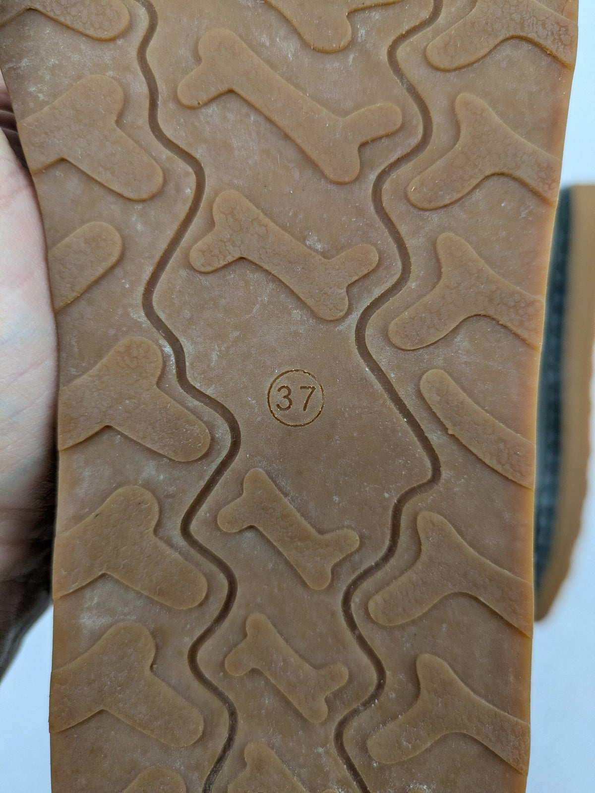 ALS green leather booties with side zipper and decorative stitching.