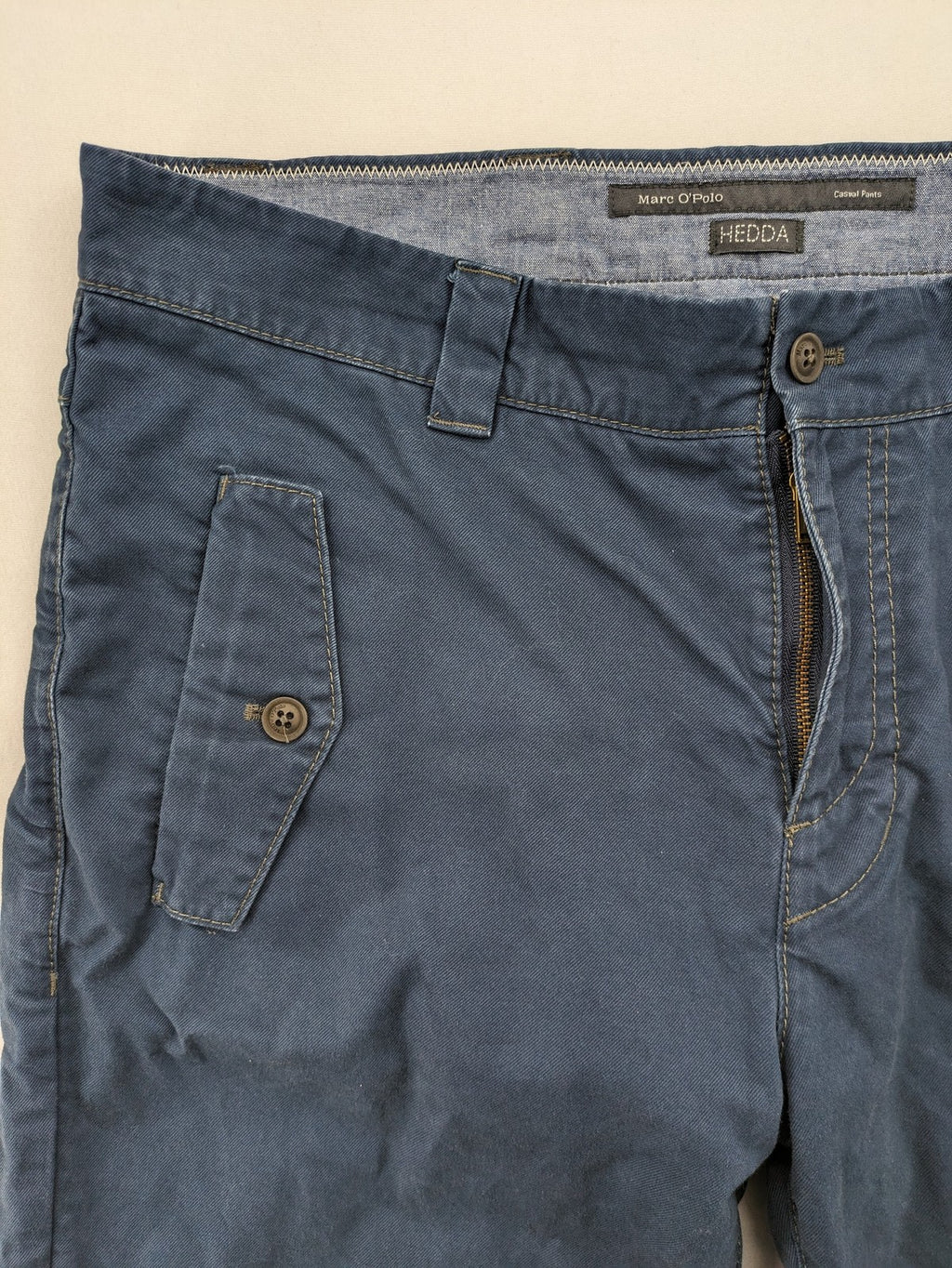 Marc O'Polo blue chino pants with button flap pockets and relaxed fit design.
