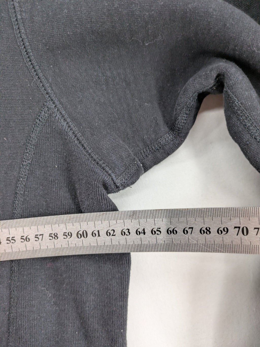 Supreme grey hoodie with embroidered small box logo, kangaroo pocket, and ribbed cuffs.