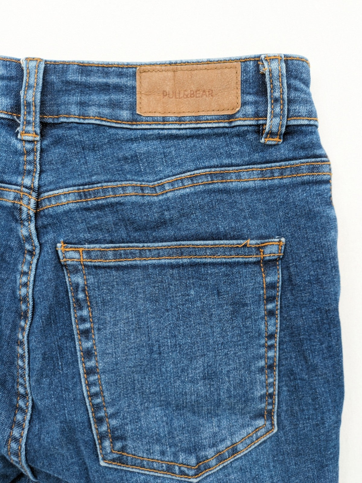 Pull&Bear blue flare jeans high waist with classic button closure and stylish silhouette.