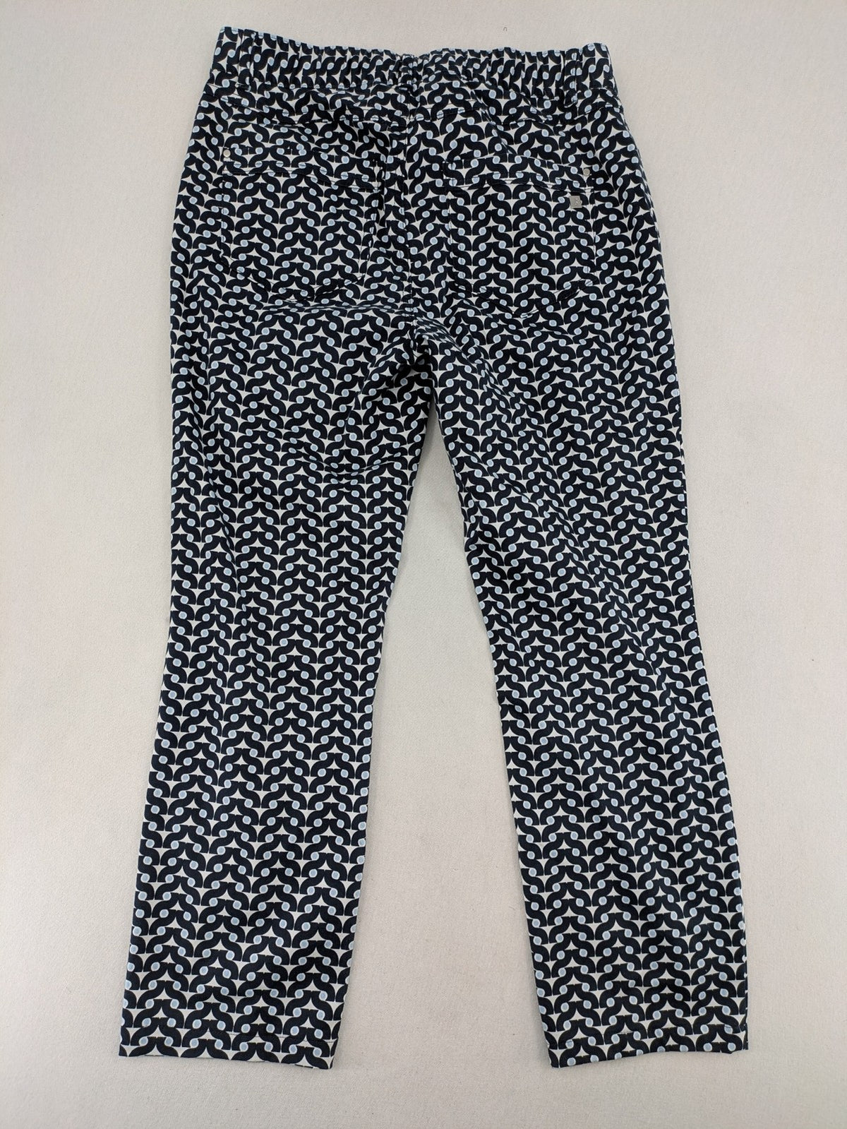 Bonita navy pants with geometric pattern, stretch material, and classic zip fly closure.