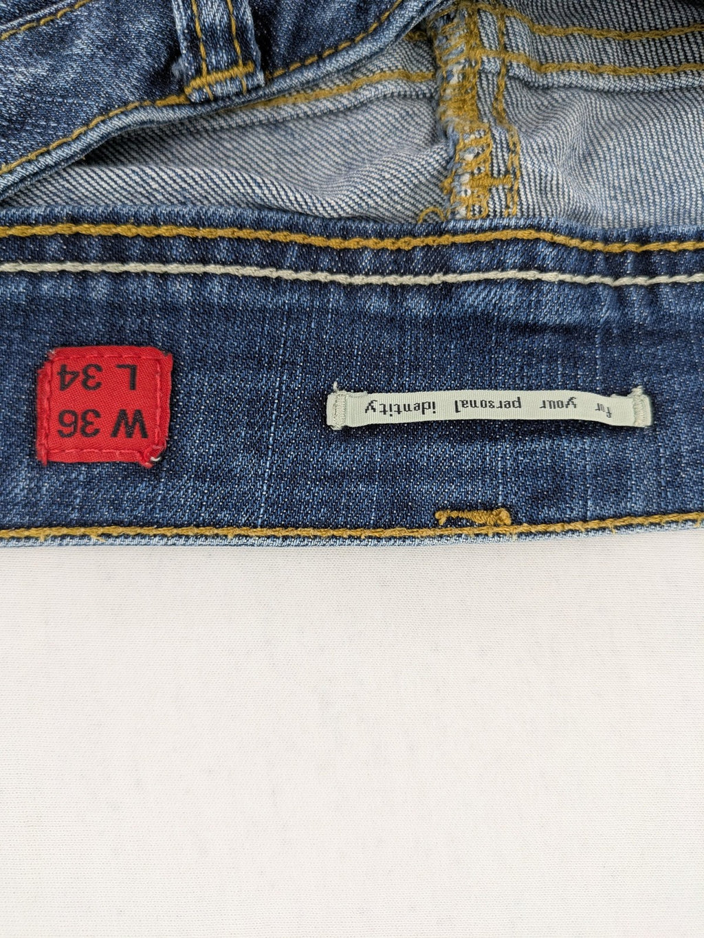 QS by s.Oliver green straight jeans five-pocket design with unique double button closure