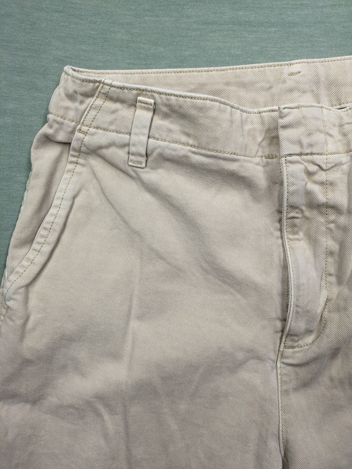 Gap beige loose-fit chino pants made from 100% cotton with relaxed wide-leg design.