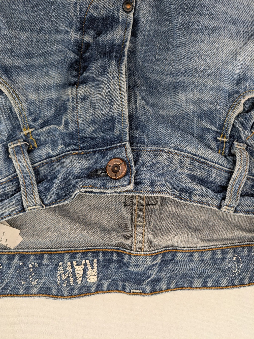 G-Star Raw blue straight jeans with distressed details and classic button fly.