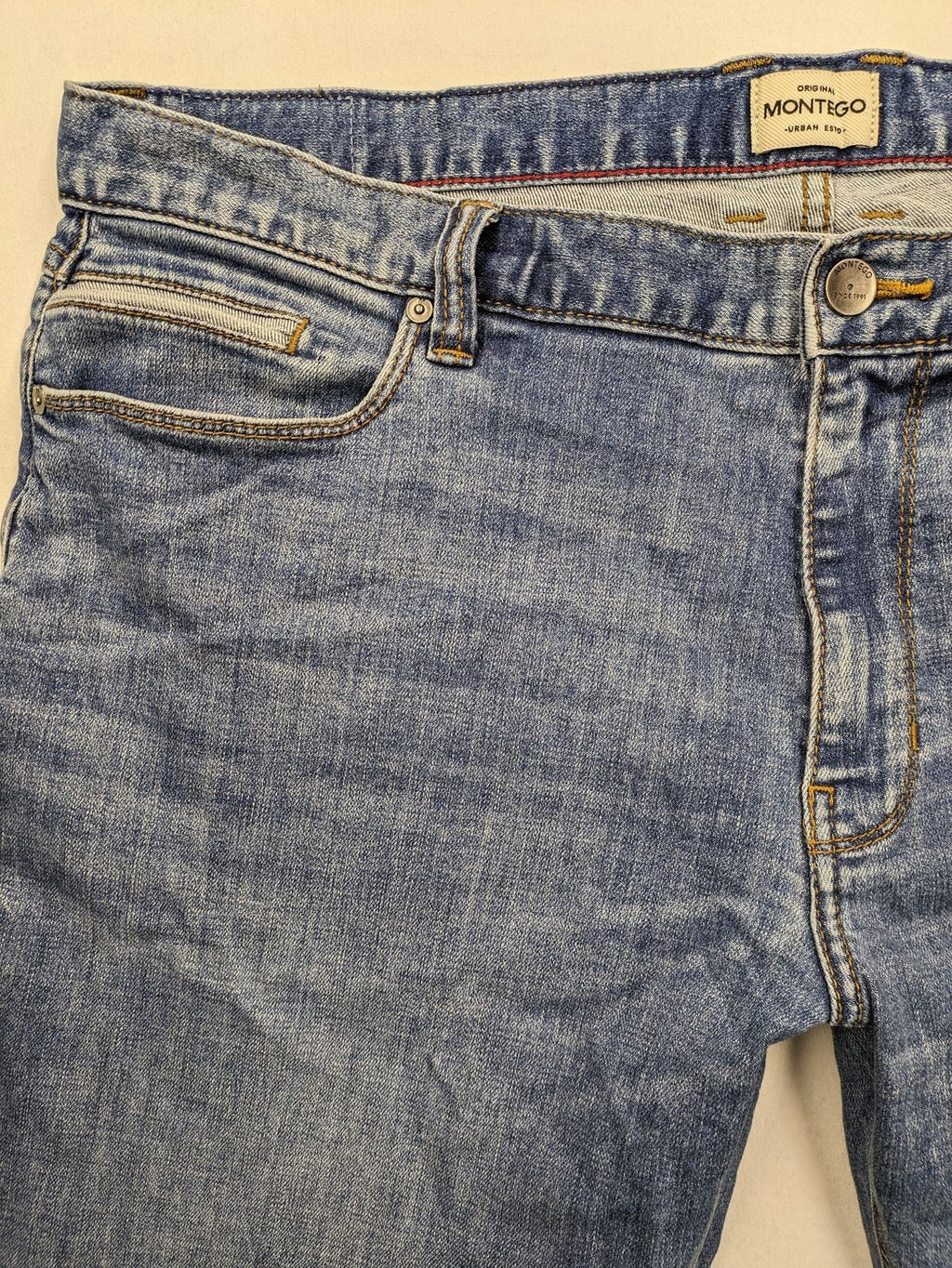 Montego blue straight jeans with stretch denim, classic design, and regular fit.