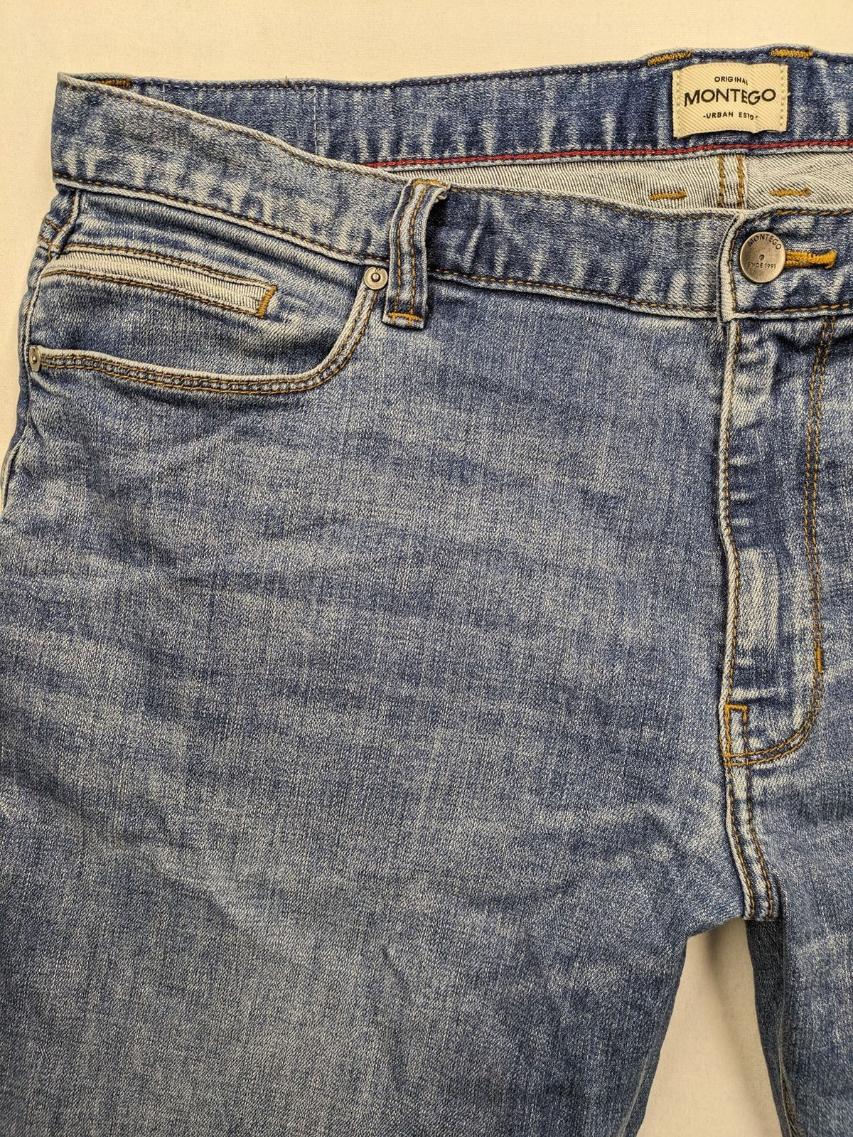 Montego blue straight jeans with stretch denim, classic design, and regular fit.