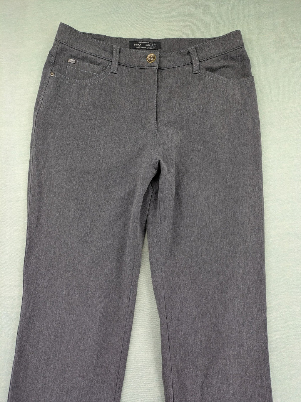 BRAX pants pink 5-pocket design with stretch material and logo detail.