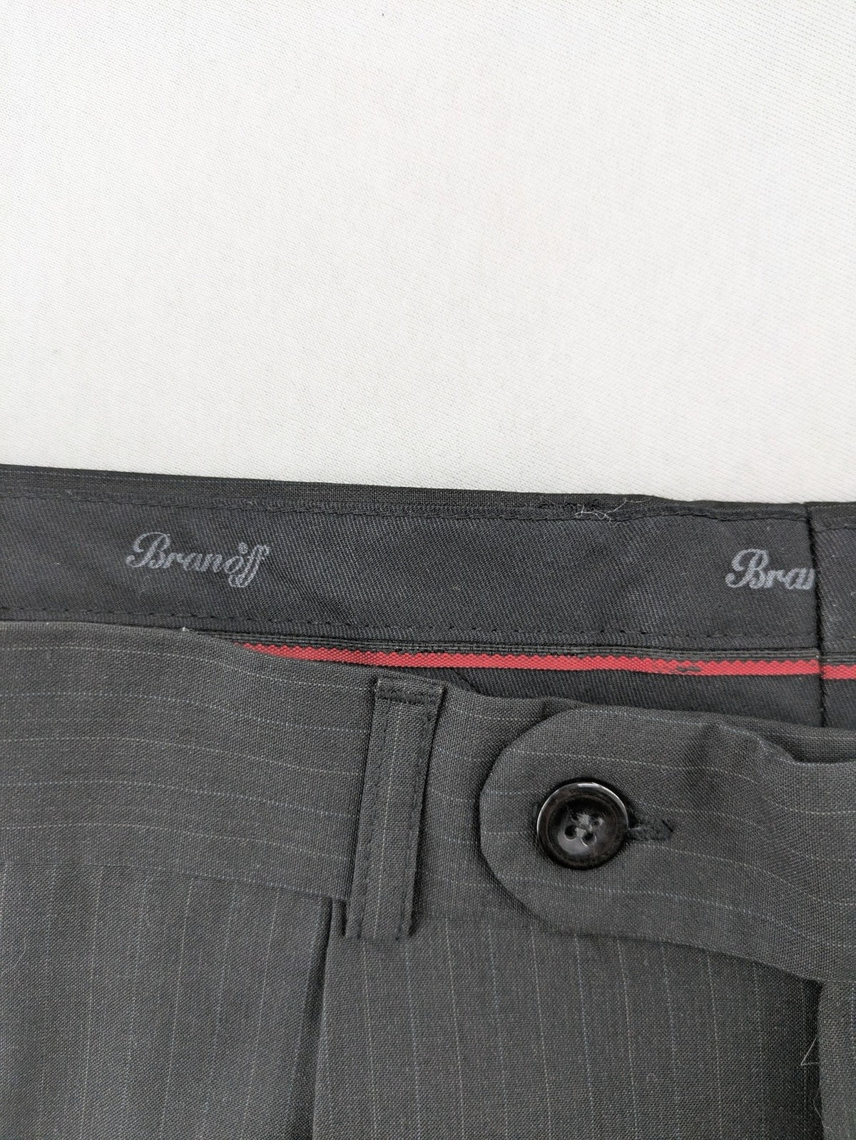 Wahl grey dress pants with pinstripe pattern and pleats, featuring side and back pockets.