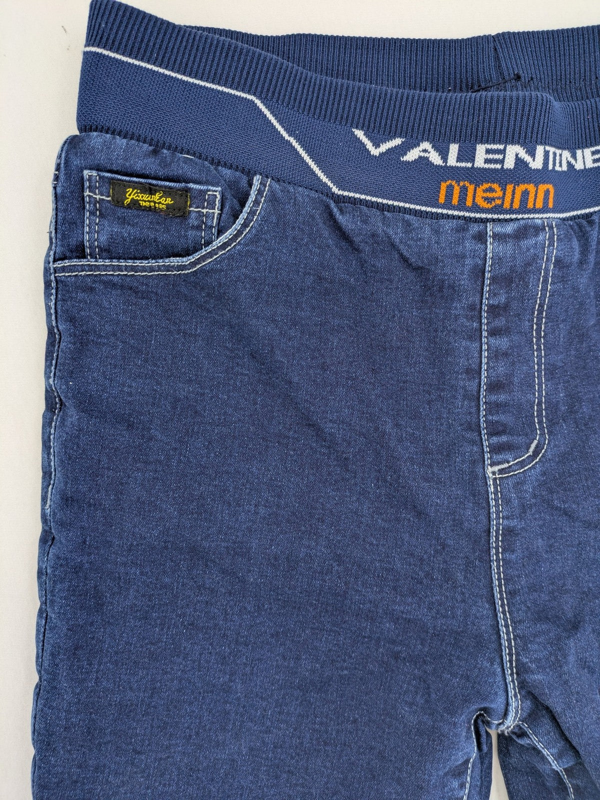 Valentine Meinn blue straight jeans with elastic waistband and soft lining, classic denim look.