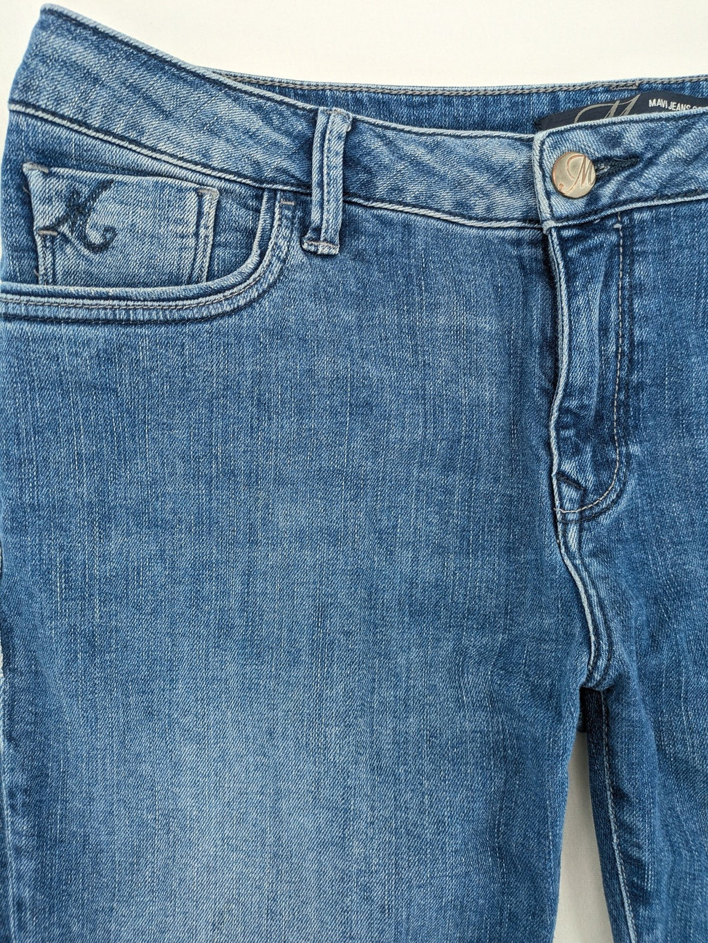 Mavi blue straight leg jeans with classic 5-pocket styling and medium wash.
