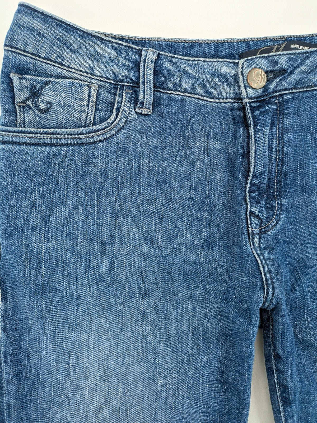 Mavi blue straight leg jeans with classic 5-pocket styling and medium wash.