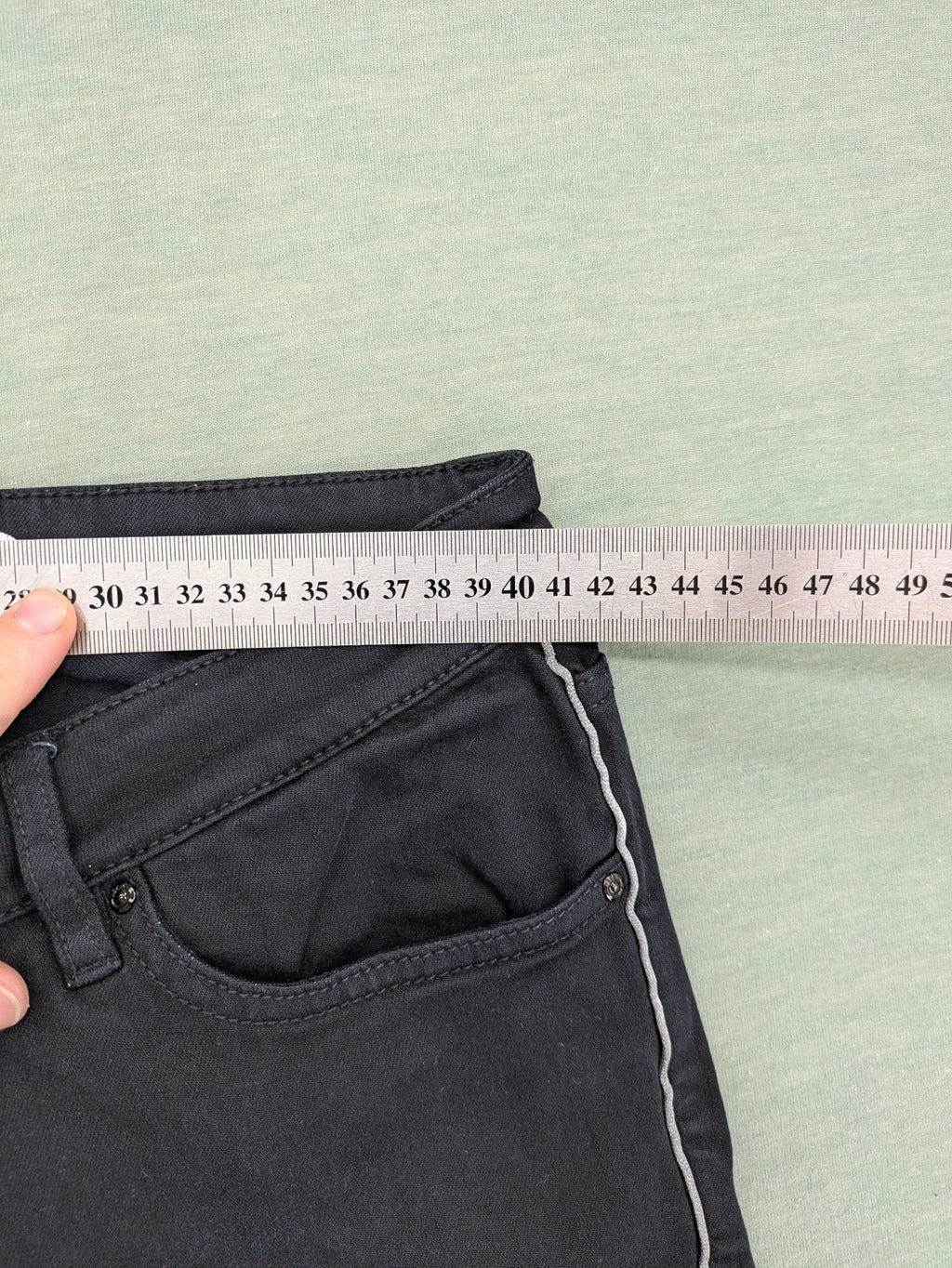 s.Oliver green straight jeans with white side stripe and classic 5-pocket style.