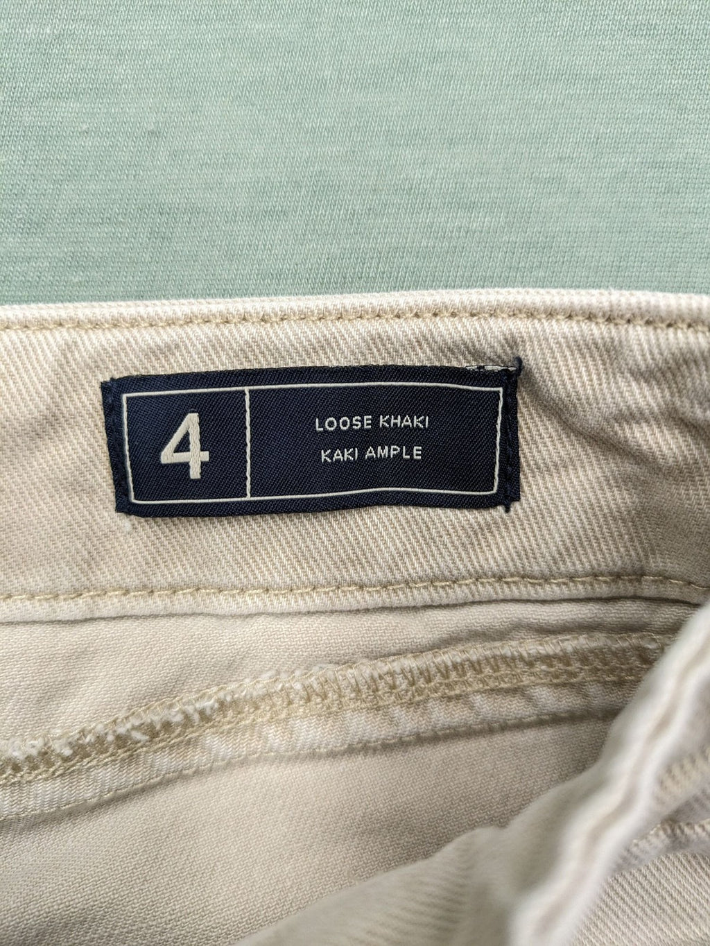 Gap beige loose-fit chino pants made from 100% cotton with relaxed wide-leg design.