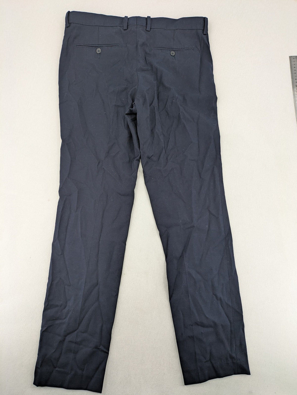 H&M navy slim fit executive suit trousers with flat-front design and side pockets.