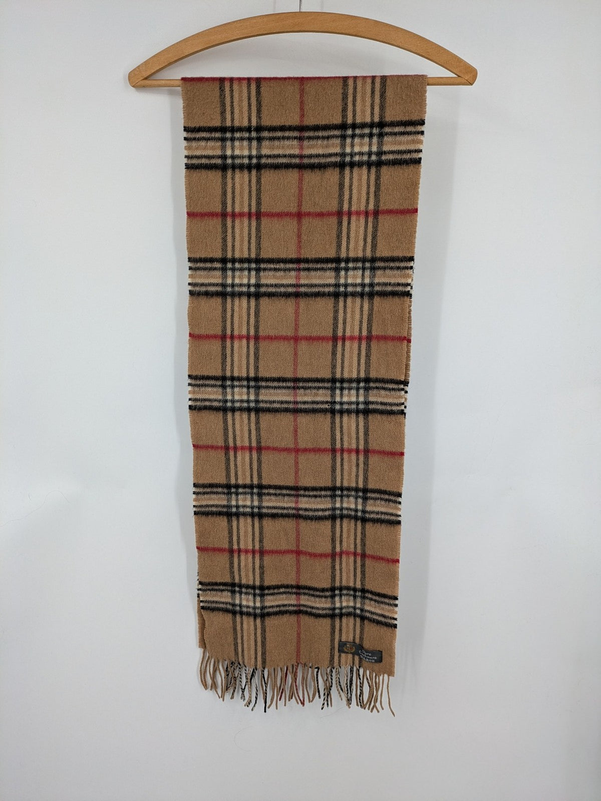 Karo unisex scarf camel brown tartan pattern 100% cashmere with black, white, and red accents.