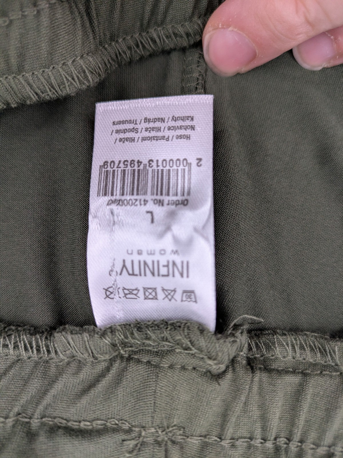 Infinity green jogger pants with elastic waistband and side pockets, soft stretch material.
