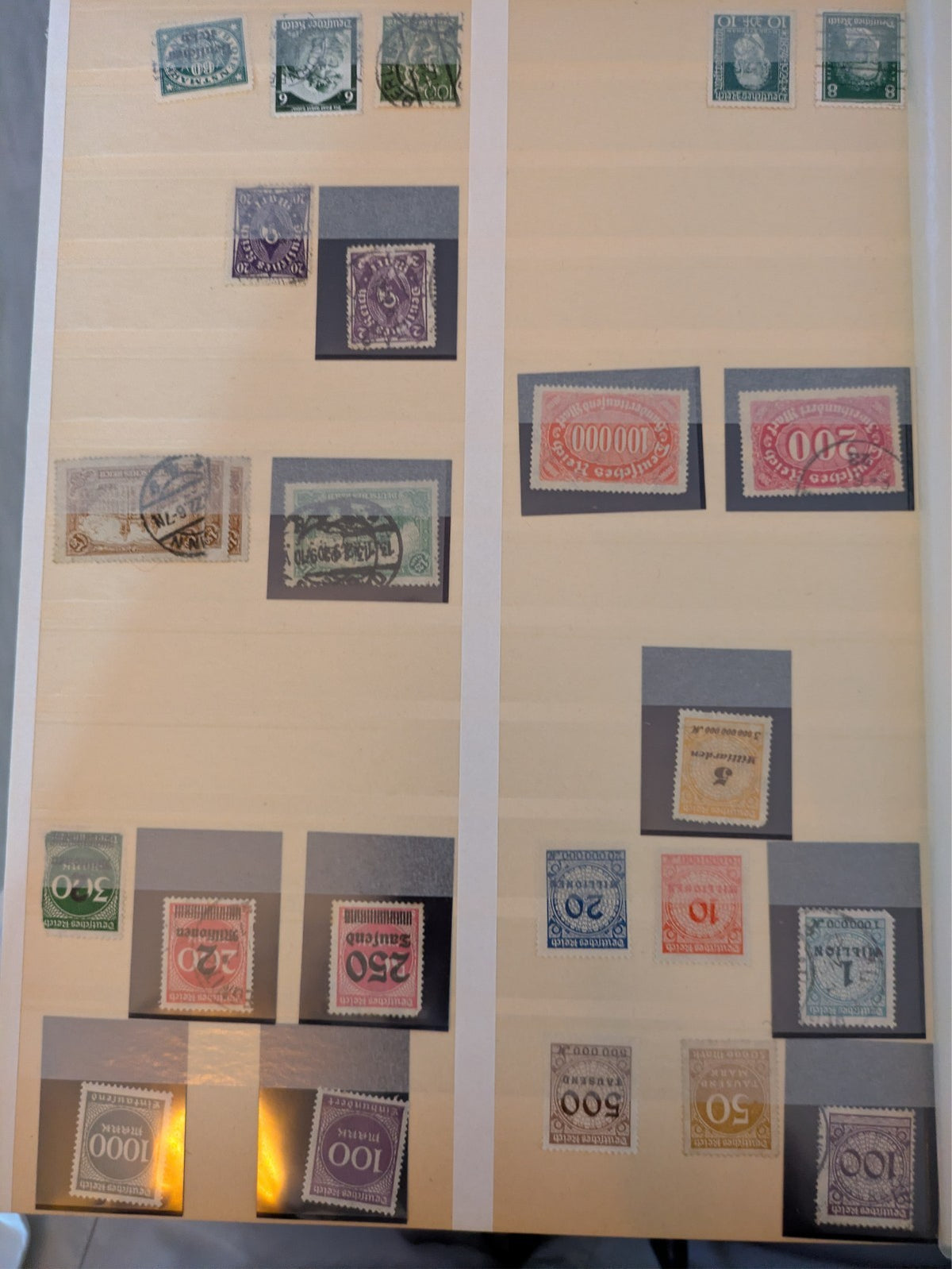 Beige postage stamp album featuring over 1000 stamps from Germany and Europe.