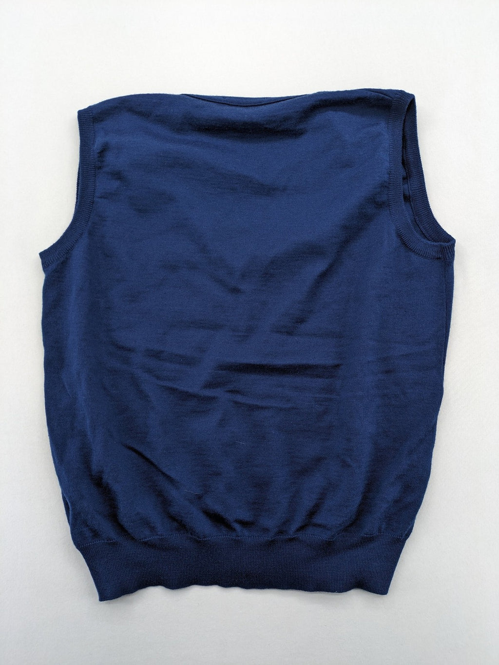 Montechiaro blue turtle neck jumper with V-neck, button placket, and sleeveless design.