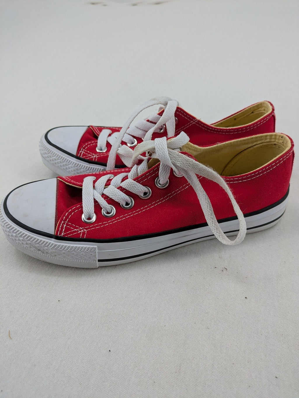 Sneaker low-top canvas sneakers red upper with white laces and rubber sole