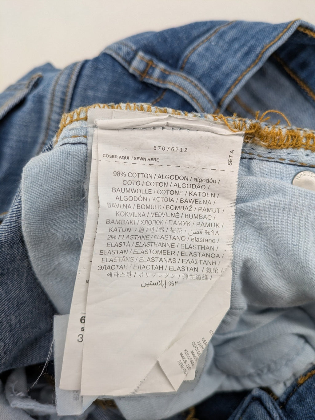 MNG blue straight jeans with kick-flare leg and raw hem, made of cotton blend.