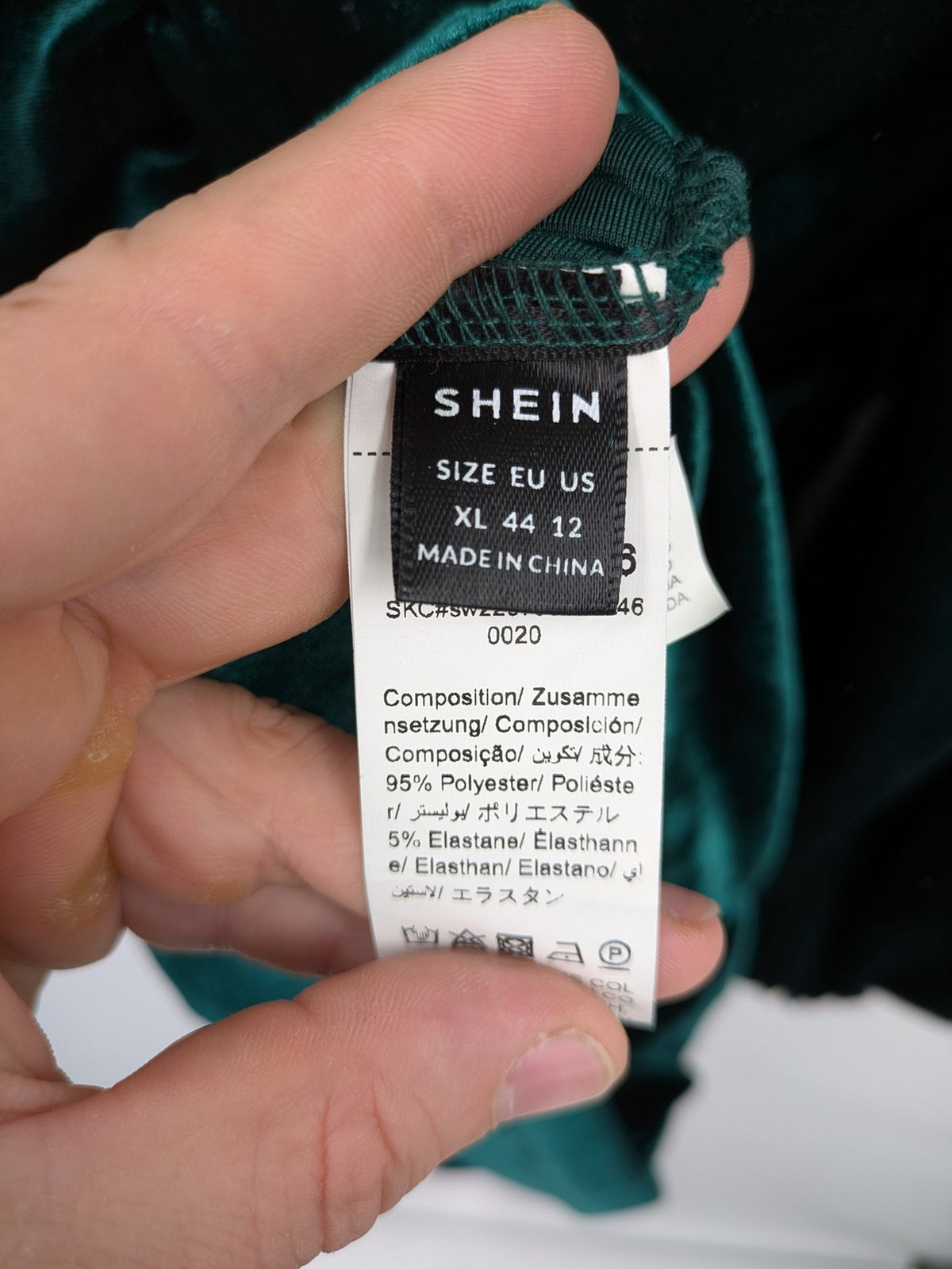 SHEIN green bodycon dress with ruched details, square neckline, and long puff sleeves.