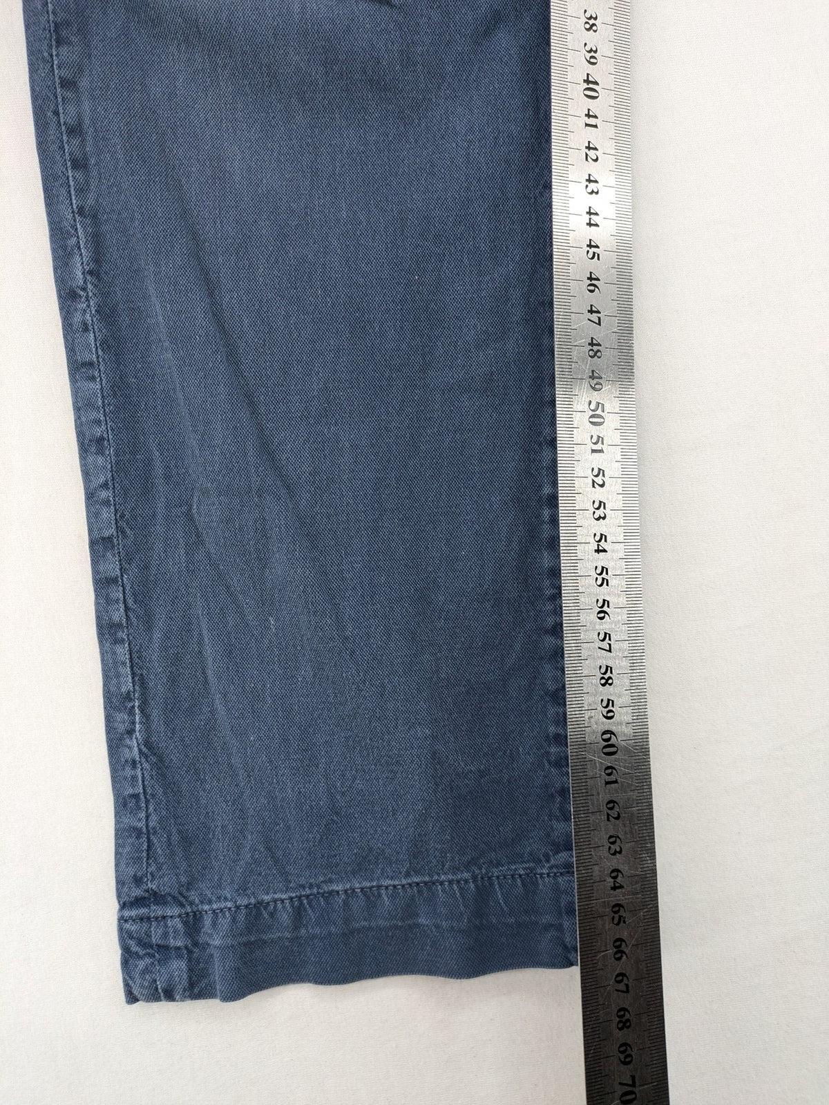 Spaghetti Mafia cream pants with elastic waistband, drawstring, and subtle front pleats.