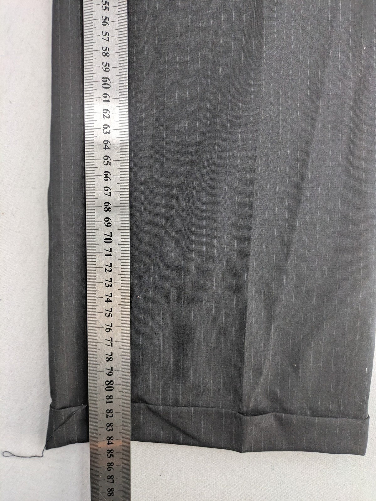 Wahl grey dress pants with pinstripe pattern and pleats, featuring side and back pockets.