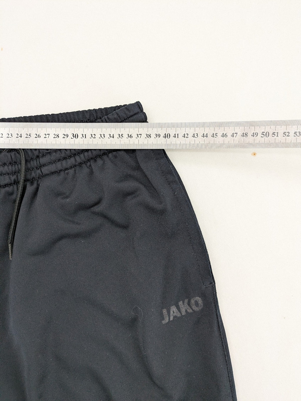 Jako black jogging pants with elastic waistband and ribbed ankle cuffs.