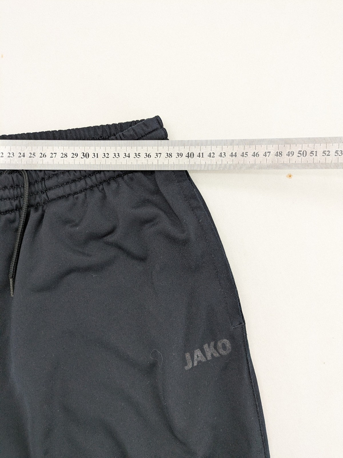 Jako black jogging pants with elastic waistband and ribbed ankle cuffs.