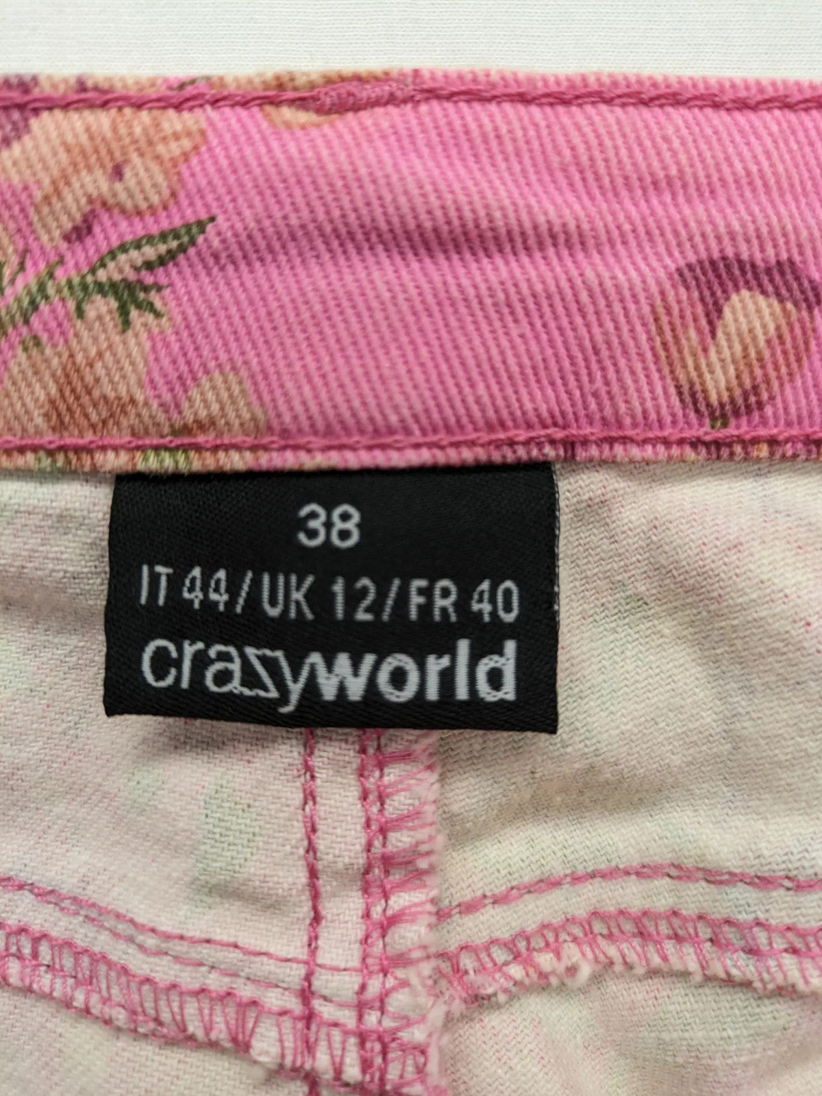 Crazy World floral straight jeans pink with 5-pocket design and slim fit.