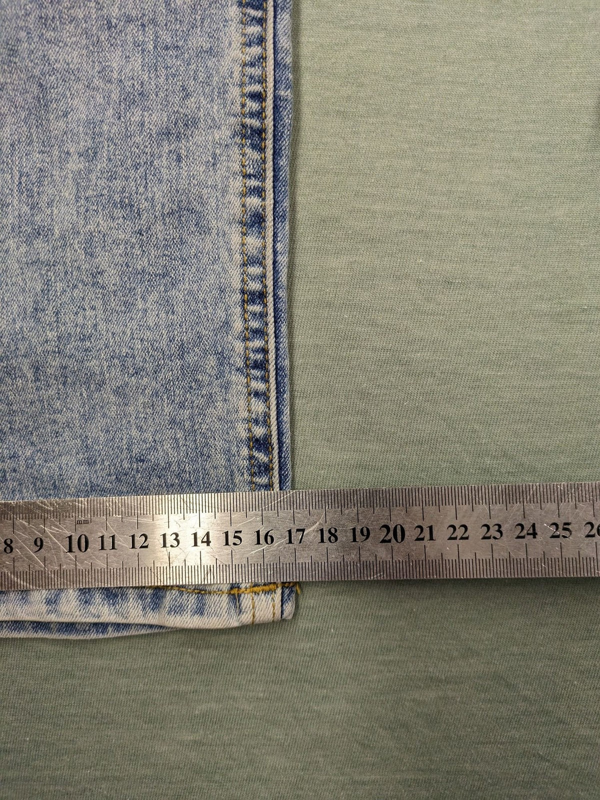 Jack & Jones blue slim fit jeans with button fly and light wash denim texture.