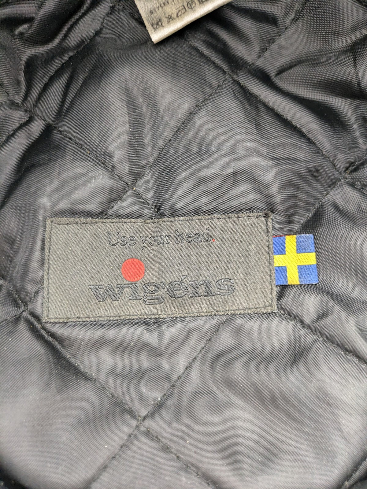 Wigéns grey flat cap wool with foldable ear flaps and classic design.