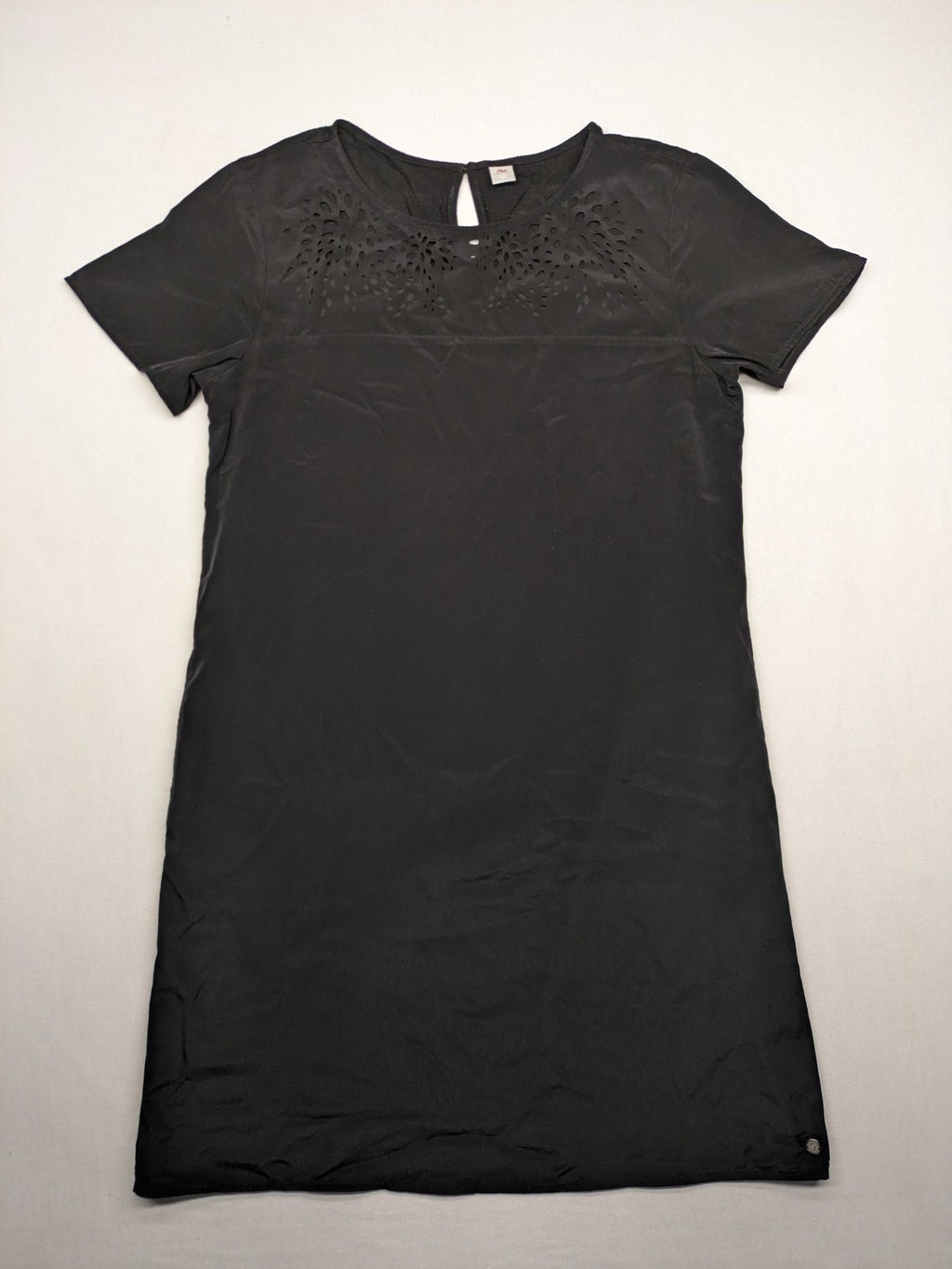 s.Oliver black shift dress with intricate cut-out pattern and keyhole neck detail.