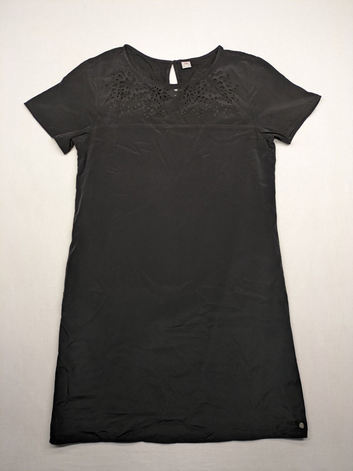 s.Oliver black shift dress with intricate cut-out pattern and keyhole neck detail.