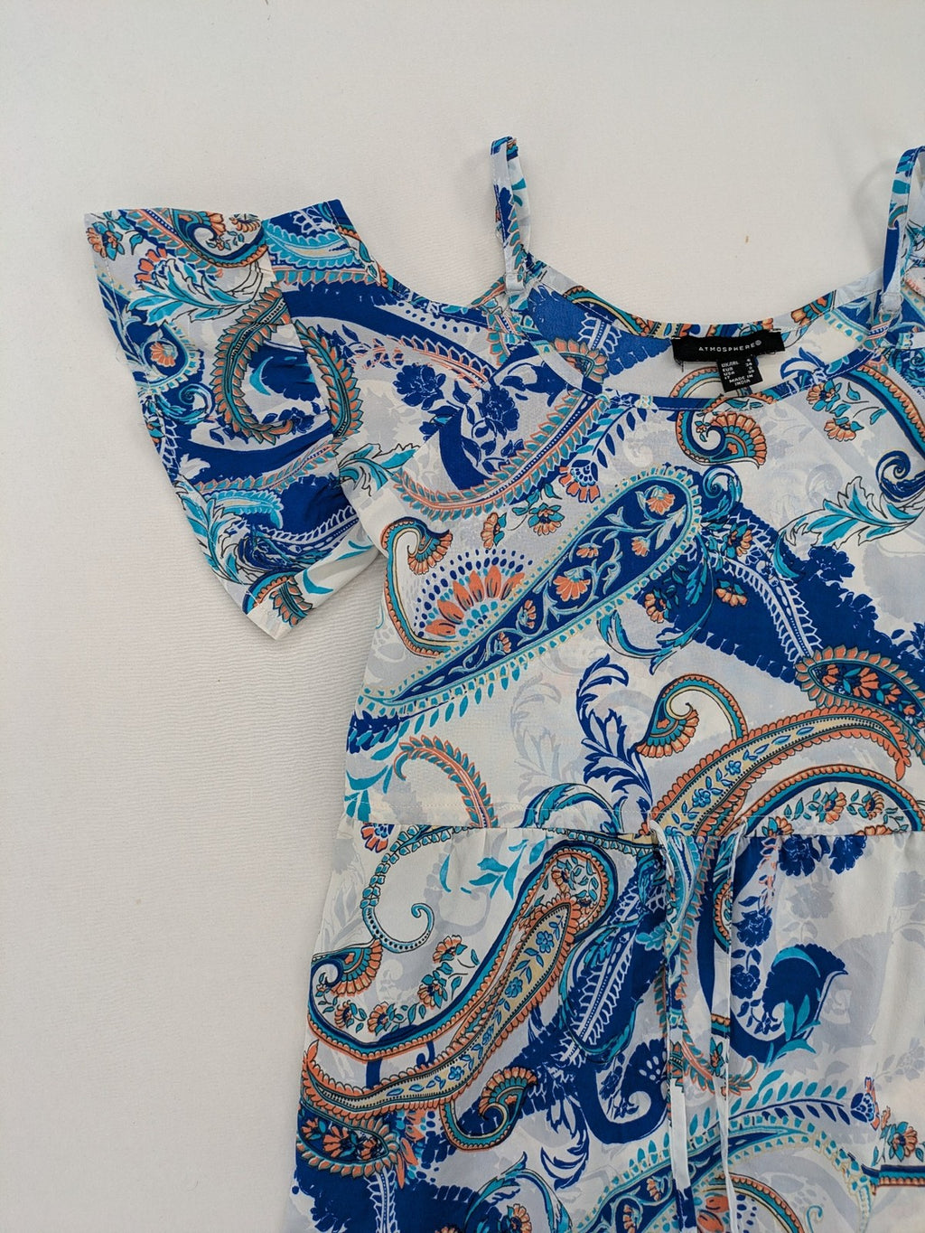 Atmosphere orange summer dress with colorful paisley pattern and cold shoulder design.