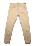 Tommy Jeans beige high rise skinny ankle jeans with logo patch and stretch fabric.