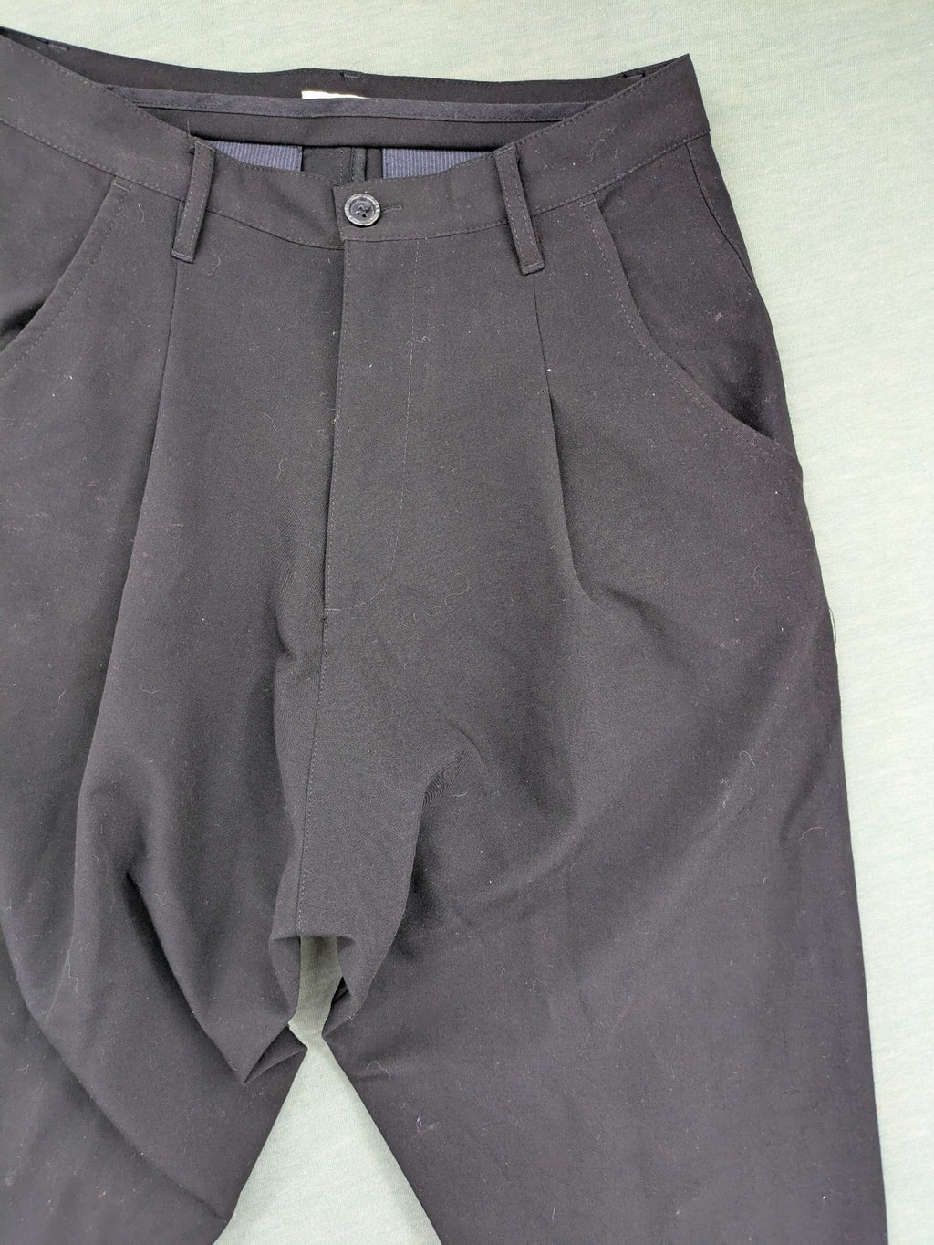 Jenny Joy pink harem pants with pleats, side pockets, and tapered legs.