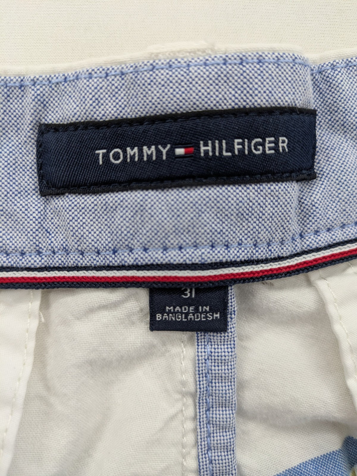 Tommy Hilfiger chino shorts blue and green striped pattern with iconic flag logo.