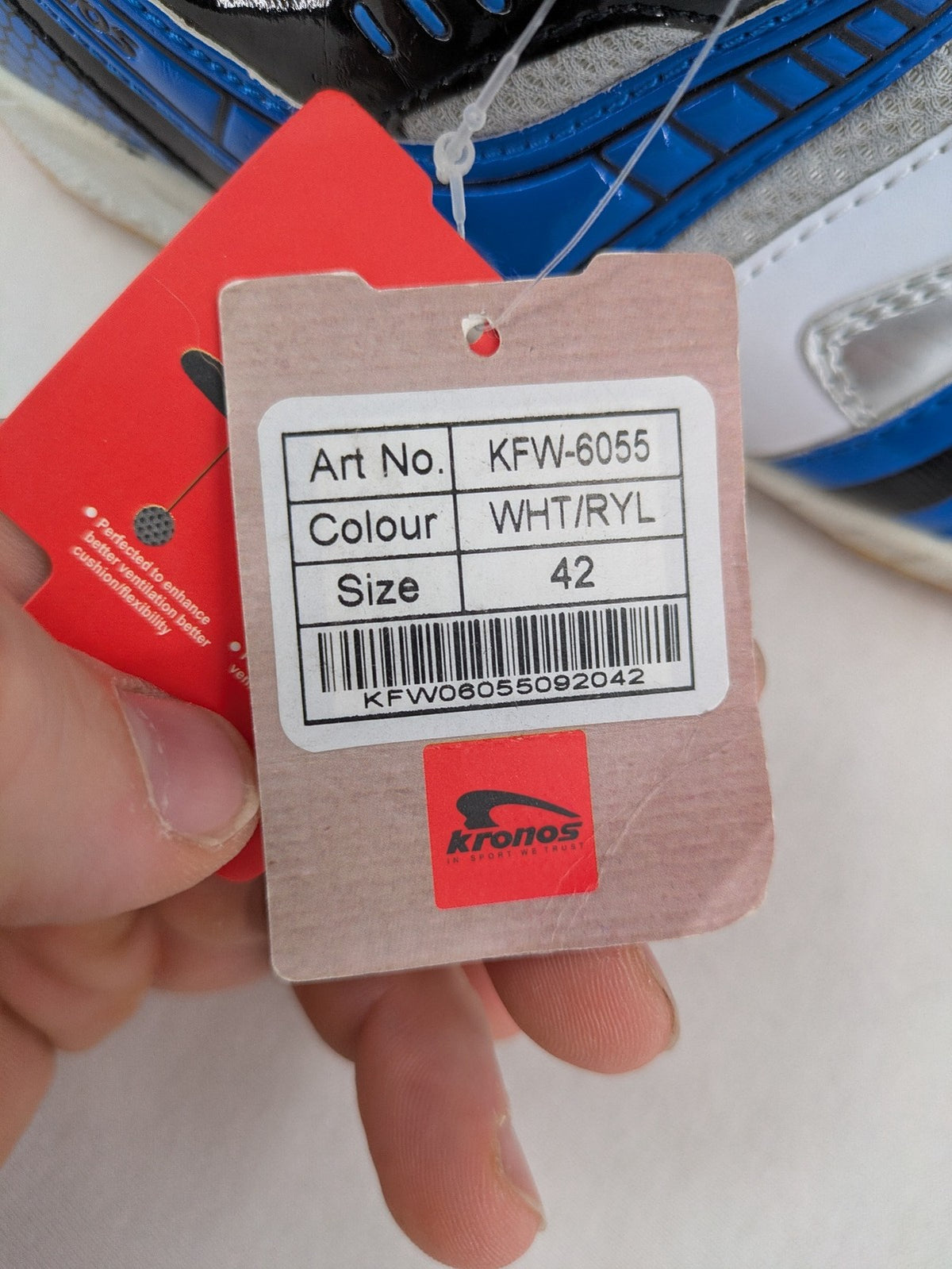 Kronos sports sneakers white, blue, and silver with durable rubber sole and classic design.