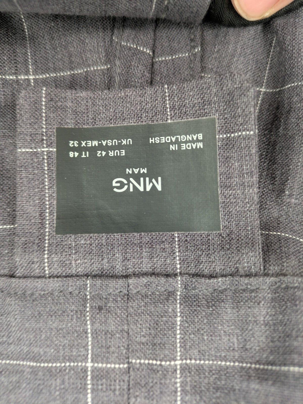 MNG Man grey plaid pants with rolled hem and stretch performance material.